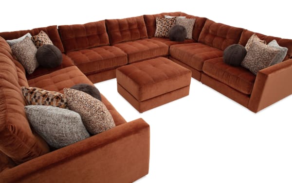 Spice-colored Jewels 9-piece modular sectional with plush polyester fabric, Bob-O-Pedic gel memory foam cushions, accent pillows, and storage ottoman.