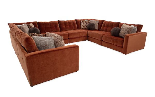 Jewels Spice 170'' 8-piece modular sectional in glam style with orange polyester fabric, featuring gel memory foam cushions and assorted accent pillows.