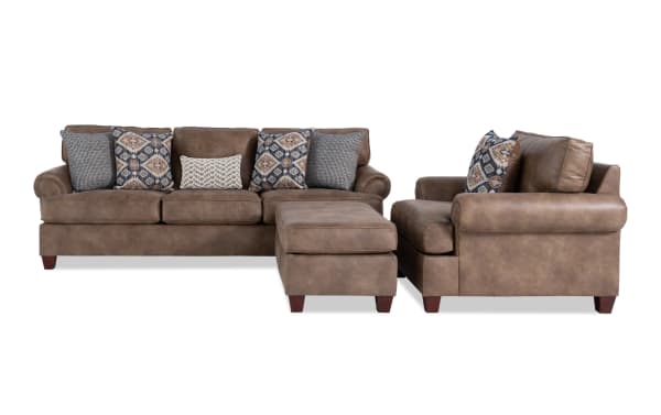 Raleigh Cognac Chair & Ottoman set in traditional style with brown faux leather polyester fabric, memory foam cushions, and patterned accent pillows.