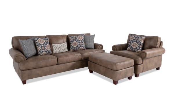 Raleigh Cognac traditional chair and ottoman set in brown faux leather polyester fabric with memory foam cushioning and patterned accent pillows.