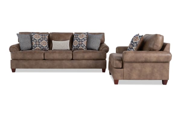 Raleigh Cognac 103'' Sofa & Chair set in traditional style with brown faux leather polyester upholstery, rolled arms, and patterned accent pillows.