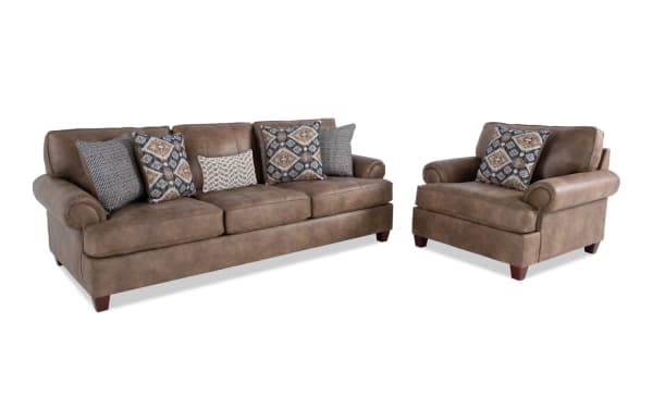 Raleigh Cognac 103'' traditional sofa and chair set in brown polyester faux leather with rolled arms, memory foam cushions, and patterned accent pillows.