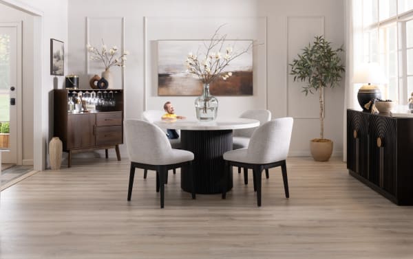 Delaney 5 Piece Black & White Marble Upholstered Round Dining Room Set with light gray polyester fabric chairs, genuine marble tabletop, and black ribbed MDF base in contemporary style.