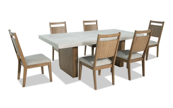 Monterey 7 Piece Natural & Gray Panel Back Upholstered Dining Set with faux concrete melamine table top and six gray fabric Bob-O-Pedic® Memory Foam chairs, traditional style.