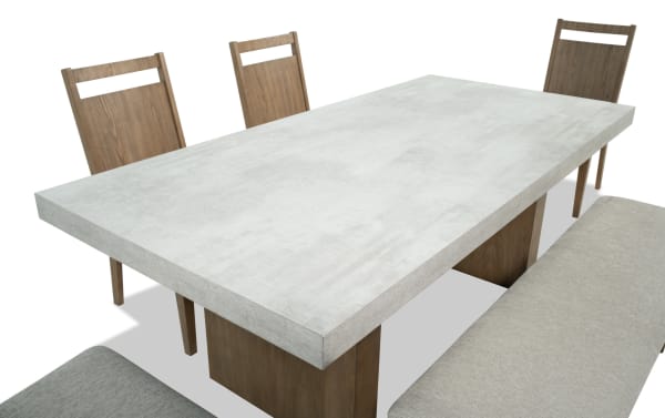 Monterey 6 Piece Natural & Gray Panel Back Upholstered Dining Set with Bench featuring a faux concrete melamine tabletop, gray fabric polyester chairs, and bench in traditional style.