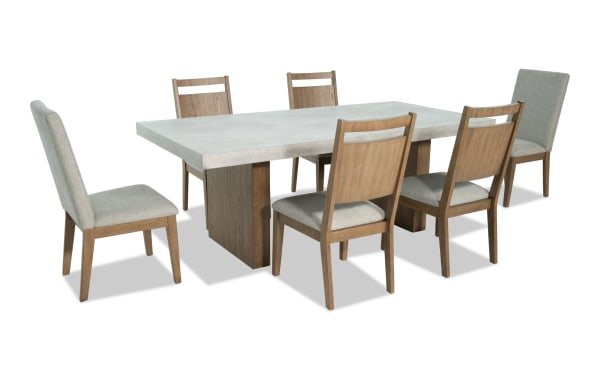 Monterey 7 Piece Natural & Gray Upholstered Dining Set with faux concrete melamine table top and six gray polyester fabric Bob-O-Pedic® Memory Foam chairs.