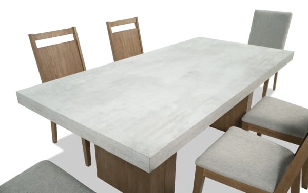 Monterey 7 Piece Natural & Gray Upholstered Dining Set with faux concrete melamine table top and six gray polyester fabric Bob-O-Pedic® memory foam chairs.