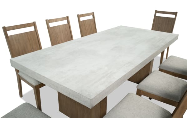 Monterey 9 Piece Natural & Gray Panel Back Upholstered Dining Set with gray faux concrete melamine table top and eight fabric polyester memory foam chairs, traditional style.