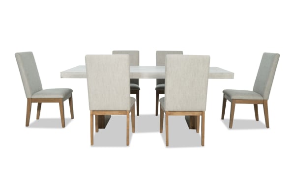 Monterey 7 Piece Dining Set with gray fabric polyester upholstered solid back chairs and faux concrete melamine tabletop in traditional style.