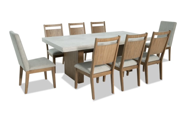 Monterey 9 Piece Natural & Gray Upholstered Dining Set with faux concrete melamine table top, eight gray fabric Bob-O-Pedic® Memory Foam chairs, traditional style.