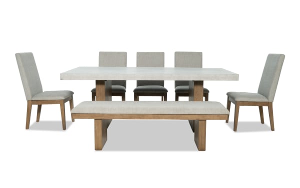 Monterey 7 Piece Natural & Gray Solid Back Upholstered Dining Set with Bench, traditional style with gray polyester fabric, faux concrete melamine table top, rubberwood and hardwood solids frame, includes five memory foam chairs and matching bench.