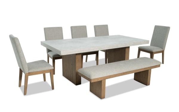 Monterey 7 Piece Natural & Gray Solid Back Upholstered Dining Set with bench, gray polyester fabric, faux concrete melamine tabletop, traditional style.