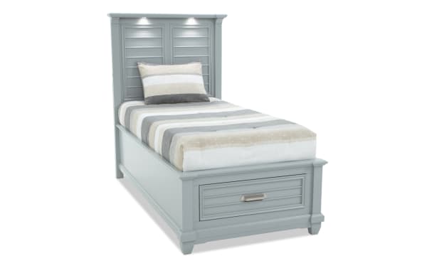 Sunset Cove Youth Twin Gray Storage Bed in coastal style with MDF frame, built-in underbed drawer, and touch-activated LED lights on headboard.