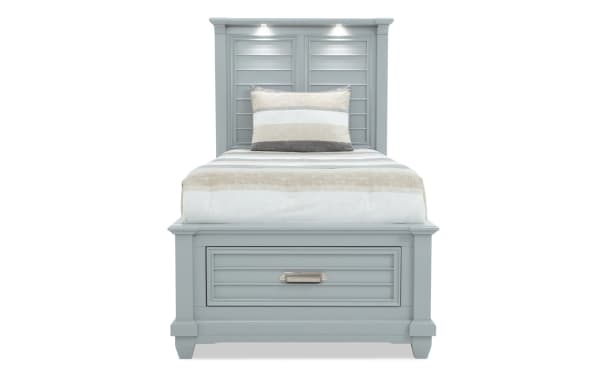 Sunset Cove Youth Twin Gray All Around Storage Bed in coastal style, MDF construction, with gray paneled headboard, built-in drawer, and LED lighting.