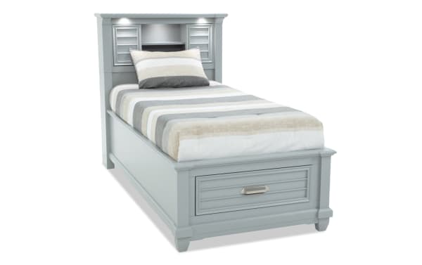 Sunset Cove Youth Twin Gray Bookcase Storage Bed in coastal style with MDF construction, built-in storage drawer, LED lights, power outlets, and USB/USB-C ports.