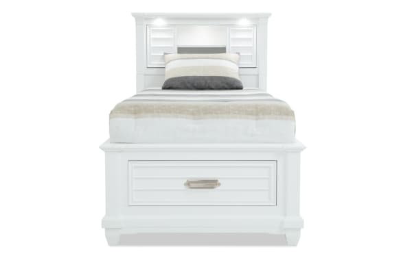 Sunset Cove Youth Twin White Bookcase Storage Bed in coastal style, MDF construction, with built-in drawer, LED lighting, power outlets, and USB/USB-C ports.