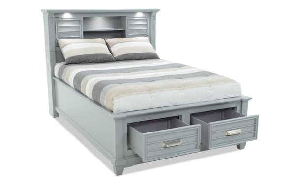Sunset Cove Youth Full Gray Bookcase Storage Bed in coastal style, MDF with built-in headboard shelves, LED lighting, USB/USB-C ports, and two storage drawers.