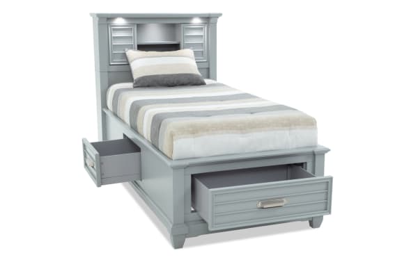 Sunset Cove Youth Twin Gray Bookcase Storage Bed in coastal style, MDF construction, with built-in drawers, LED lighting, power outlets, and USB/USB-C ports.