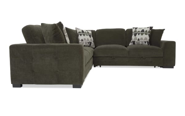 Dark olive green fabric sectional sofa with L-shape design, plush cushions, patterned accent pillows, and low block legs for modern living rooms.