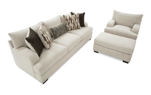 Cypress Beige 97'' transitional sofa, chair & ottoman set in beige polyester fabric with Bob-O-Pedic® Memory Foam cushions and accent pillows.