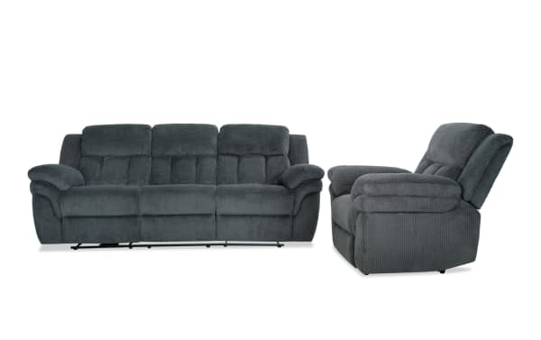 Dark gray fabric reclining sofa and armchair set with plush cushions and padded armrests, designed for living room comfort and relaxation.