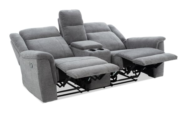 Gray fabric reclining loveseat with center console, cup holders, padded armrests, and adjustable footrests for living room comfort.