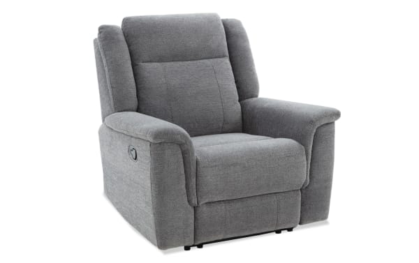 Gray fabric upholstered recliner chair with padded armrests and cushioned backrest, featuring a side lever for reclining adjustment.