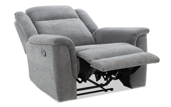 Gray fabric upholstered recliner chair with padded armrests and cushioned backrest, featuring a manual lever for footrest extension.