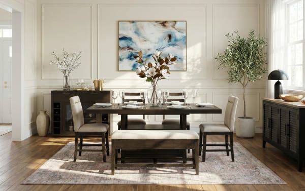 Dining room setup with dark wood table, beige upholstered chairs and bench, floral centerpiece, abstract wall art, and natural light.