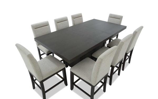 Encore 9 Piece Brown & Beige Upholstered Extendable Storage Counter Height Dining Set with polyester fabric seats, MDF/acacia veneers, and memory foam stools.