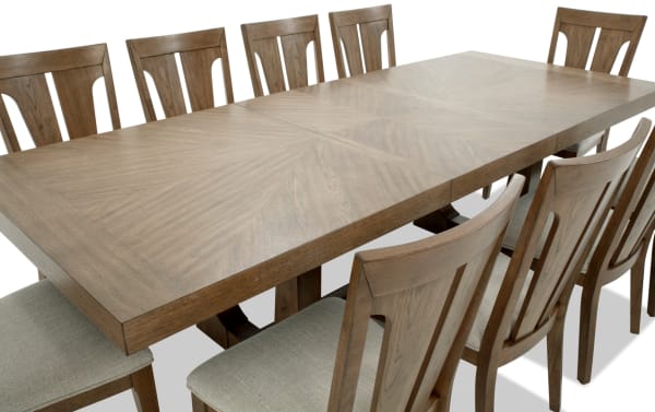 Melrose 11 Piece Natural & Beige Slat Back Extendable Dining Set with rectangular hickory veneer table, rubberwood solid frame, beige polyester fabric chairs, and memory foam cushions.