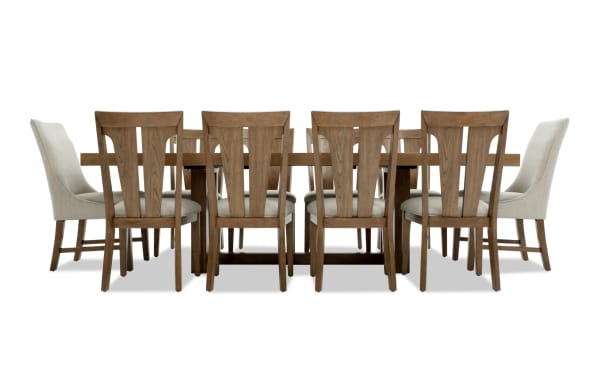 Melrose 11 Piece Natural & Beige Upholstered Extendable Dining Set with rectangular rubberwood table and beige polyester fabric chairs.