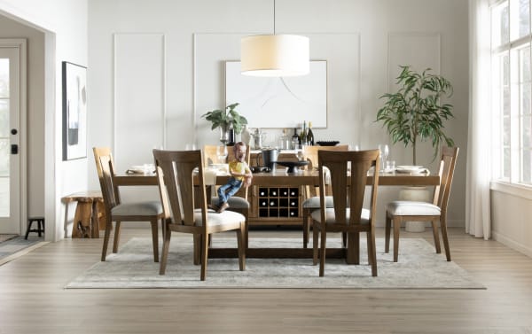 Melrose 11 Piece Natural & Beige Upholstered Extendable Dining Set with rectangular rubberwood table, polyester fabric chairs, and memory foam cushions in transitional style.