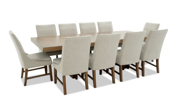 Melrose 11 Piece Natural & Beige Solid Back Extendable Dining Set with rectangular MDF and rubberwood table, beige polyester fabric chairs, and memory foam cushions.