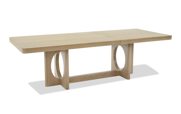 Malibu Natural Extendable Dining Table from Malibu Dining collection, crafted in solid natural acacia wood with a sleek contemporary design and oval cutout legs.