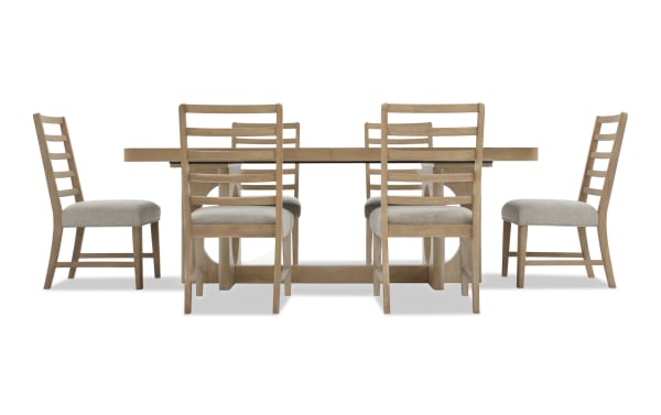 Dining set with a rectangular wooden table and six matching ladder-back chairs with beige upholstered seats, featuring a natural oak finish.