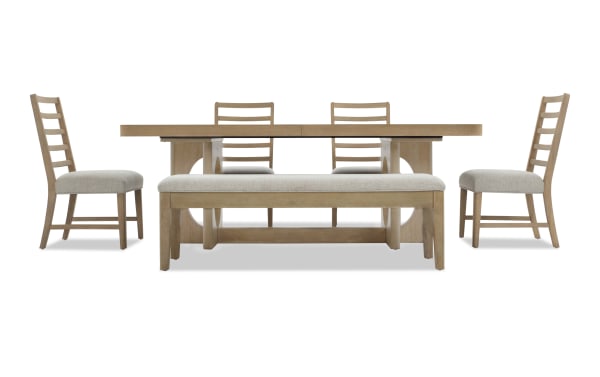Dining set with light wood finish including rectangular table, four ladder-back chairs with beige upholstered seats, and a matching bench.
