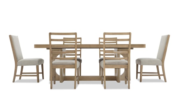 Dining set with a rectangular wooden table and six chairs, featuring light beige upholstered seats and backs, modern rustic style.