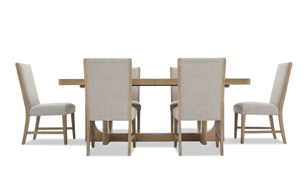 Dining set with a rectangular wooden table and six beige upholstered chairs featuring wooden legs and high backs, suitable for modern dining rooms.