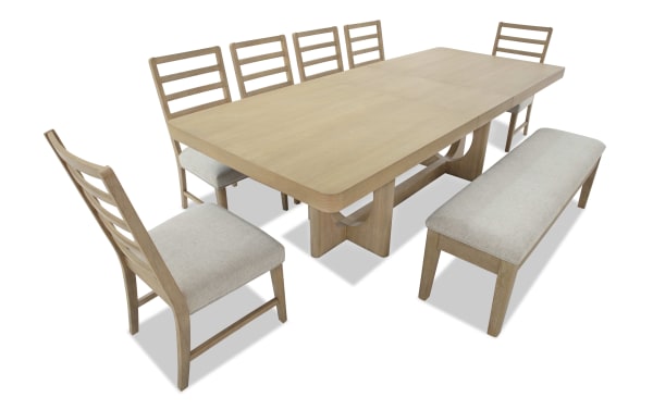 Malibu 8 Piece Natural & Gray Upholstered Extendable Dining Set with solid acacia wood, gray polyester fabric, memory foam cushioned chairs, and bench.