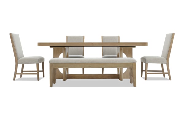Dining set with light wood finish, featuring a rectangular extendable table, four beige upholstered chairs, and a matching bench with cushioned seat.
