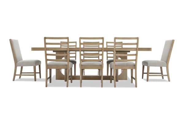 Dining table set with a rectangular wooden table and eight matching chairs featuring light beige upholstered seats and ladder-back design, ideal for modern dining rooms.