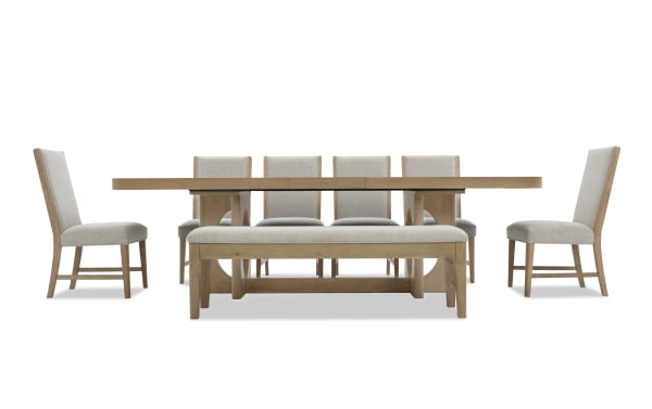 Dining set with a natural wood rectangular table, four beige upholstered chairs with wooden legs, and a matching cushioned bench.