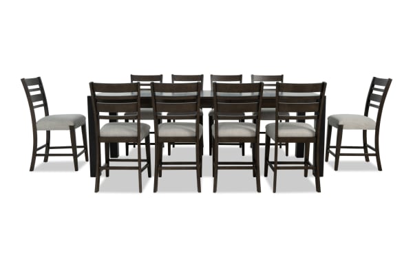 Aurora 11 Piece Brown & Black Ladder Back Extendable Storage Counter Height Dining Set with gray polyester fabric seats, transitional style, MDF and rubberwood frame, featuring two lift-top storage compartments and extendable table from 86" to 102".