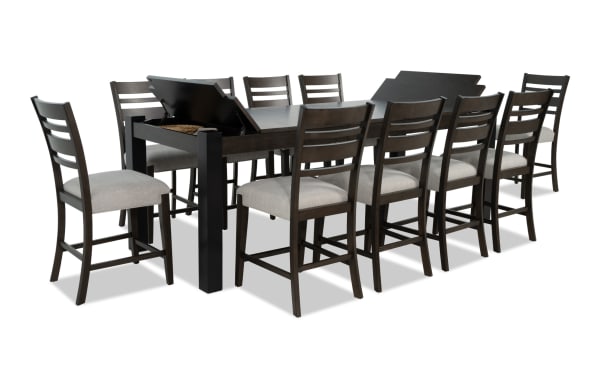 Aurora 11-piece brown and black ladder back extendable counter height dining set with gray polyester fabric seats, MDF and rubberwood solids, featuring lift-top storage compartments.