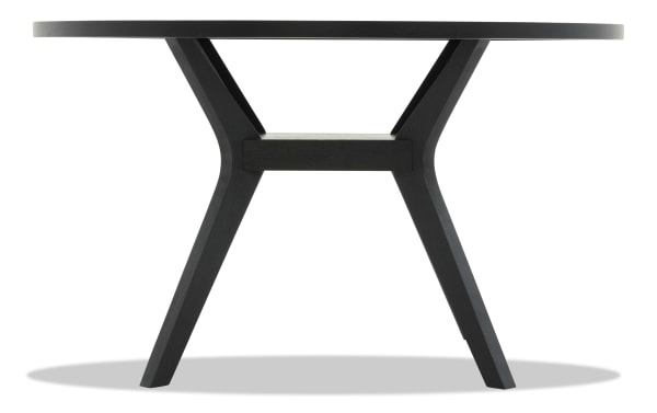 Round black wooden dining table with angled legs and a sturdy crossbar support, modern minimalist style for home or office.