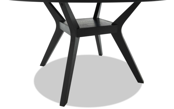 Black wooden table legs with a modern, angled design and a central support shelf, highlighting sturdy construction and sleek finish.