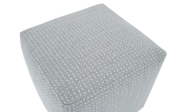 Contemporary Julia Gray Pouf in gray polyester fabric with a bold square shape and subtle textured pattern, durable and soft upholstery.