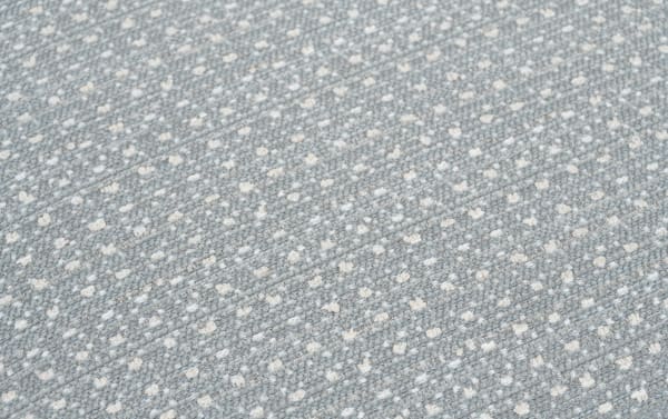 Contemporary Julia Gray Pouf in gray polyester fabric with textured woven pattern and small white dots, durable and stylish seating accessory.