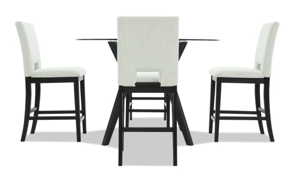 Modern dining set featuring a round glass table with black wooden legs and four upholstered beige fabric chairs with black wooden frames.